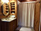 The Main Floor Bathroom has a antique copper sink and a shower/tub unit
